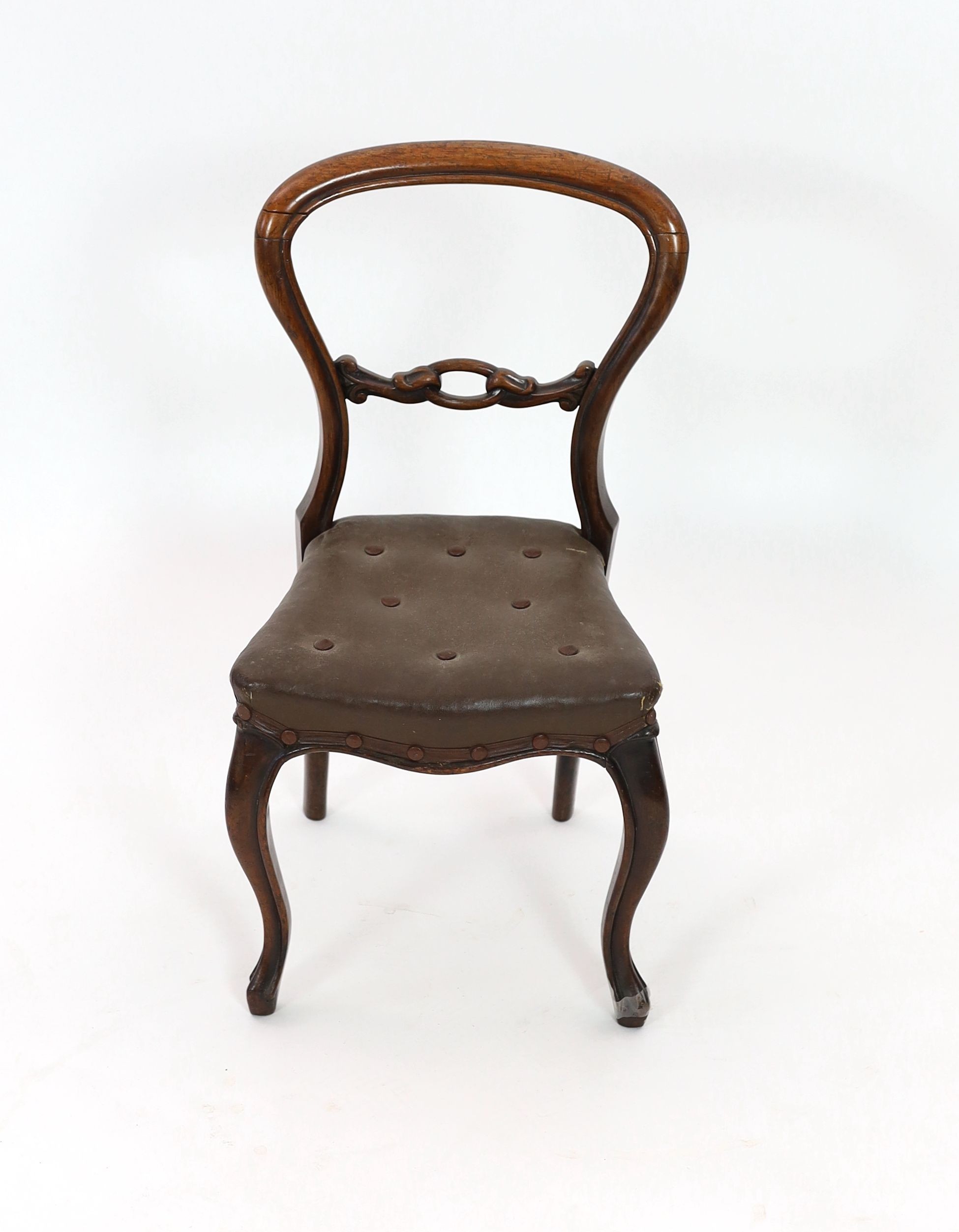 A Victorian faded rosewood spoonback child's chair, height 63cm